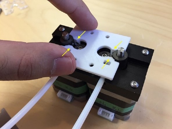 Replace the Teflon tubing on the drives and install the Drive Cover with the flat side facing up. The cover may be tight, so ensure that the cover rests flat against the drives. Please also ensure that the square cutouts are in-line with the acrylic tube holders.