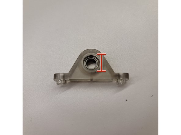 On the ingoing drive brackets, remove the old bearing by using the bottom of a screwdriver to push it out.