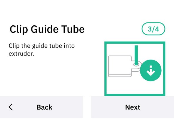 Once the filament is gripped by the extruder’s gears, continue jogging the filament to insert the tube end into the clip grommet.