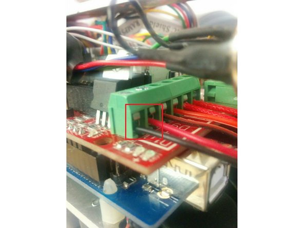 On the electronics board, re-insert the red and black wires into D10. With the board facing up, insert the red wire into the right input and the black wire into the left input.