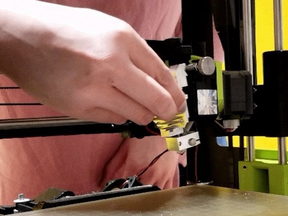 Gently separate the heat sink from the motor assembly. Remove the heat sink slowly and cautiously as the idler spring may fall out.