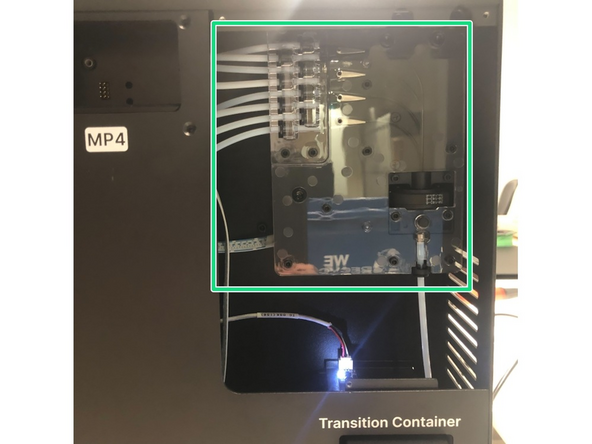 Manually feed filament through the Material Pod slots
