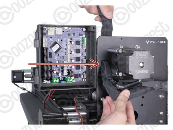 Feed the twisted bundle of wires through the square hole on the Y-Carriage.