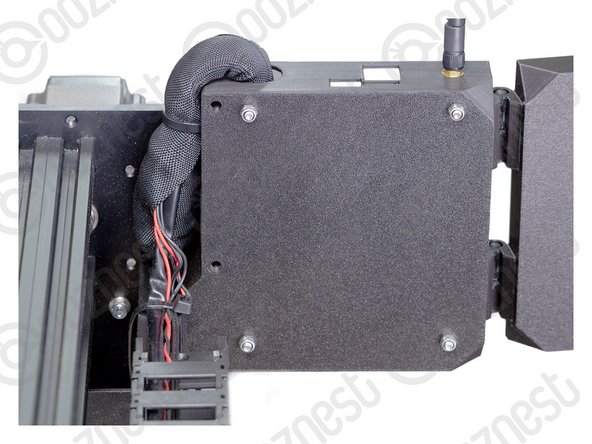 The large cable tie should go around the Cable-Sleeve bundle inside and outside the Controller-Case to sandwich it all together.