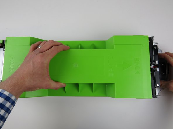 Lift the lid and remove