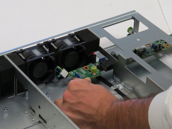 Insert the new midplane board through the PSU slot.