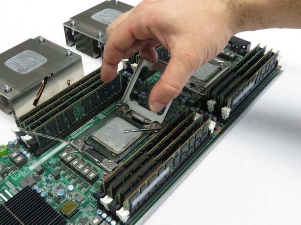 Remove the CPU and place it on top of its adjacent heatsink