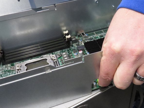 Loosen the thumbscrew.