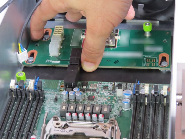 Slide the midplane board towards the fans, until resistance is felt.