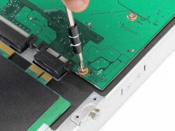 Install the thirteen Phillips #1 screws that were previously removed.