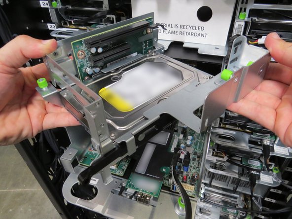 The PCI riser card will be properly unseated when a distinctive 'click' is felt.