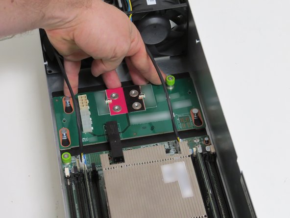 Slide the board towards the front of the server, until resistance is felt.