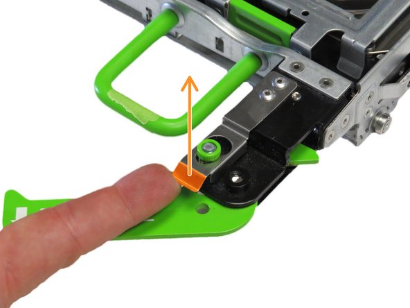 These release levers secure the tray to the storage chassis.