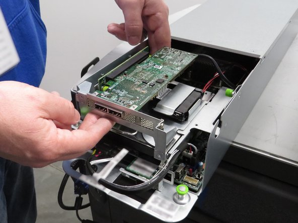 Lift the cage upwards.