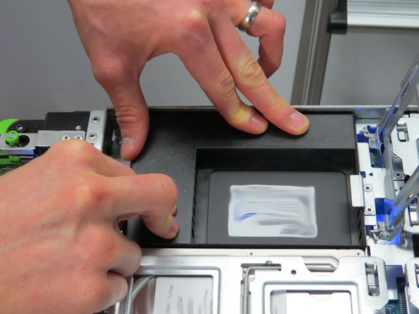 Push the SSD toward the HDD locking gate to connect the SSD.