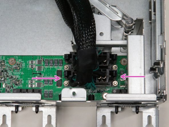 Press the tabs on the Powerblade cable to release the cable.