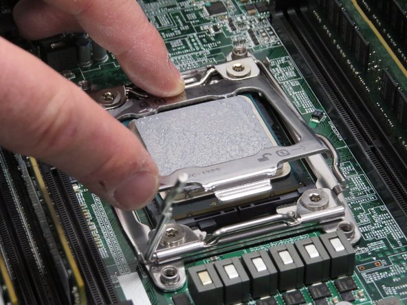 Engage the CPU retention housing, as shown.