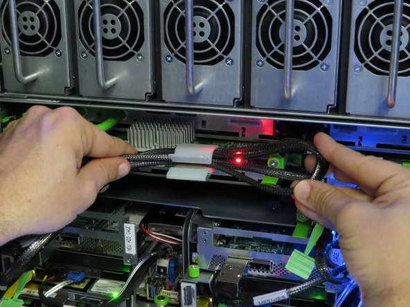 Secure the SAS cable in the nylon cable management clip.