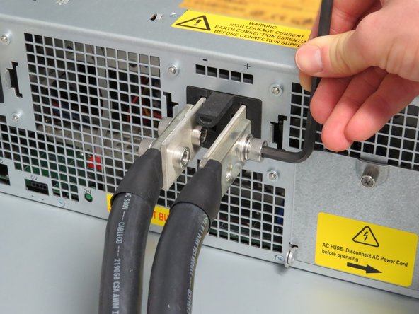 Disconnect the power lug cables using a 5mm Allen wrench.