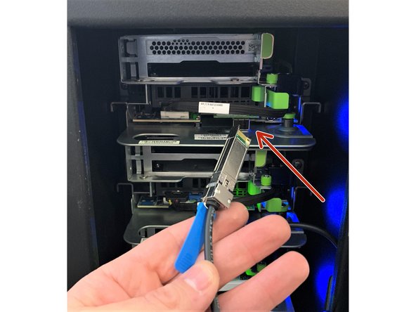 Carefully insert the 10G SFP+ cable into the NIC (Network Interface Controller) port, ensuring it locks into place.