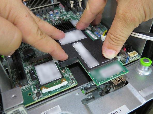 Press the NIC onto the nylon standoffs.