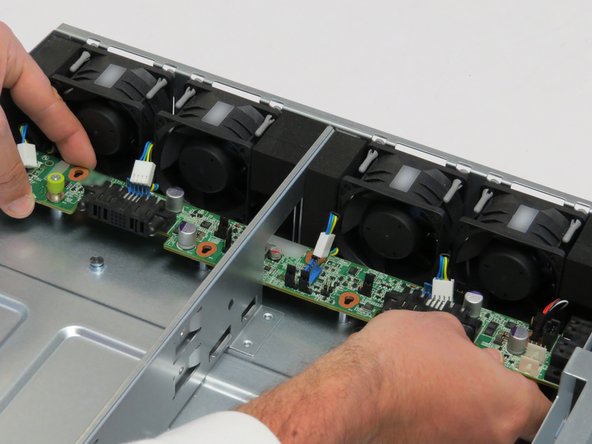 Lift the board away from the chassis.