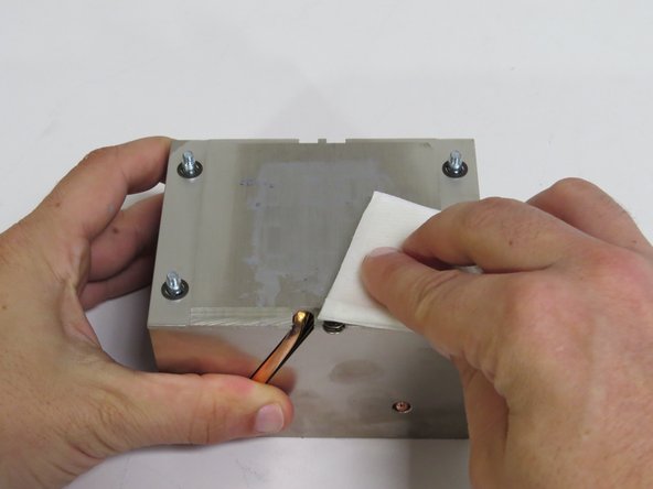 Wipe the remaining thermal compound off of the heatsink with an ispropyl alcohol pad.