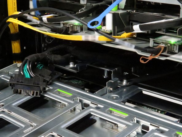 Slide the storage tray back into the storage chassis.