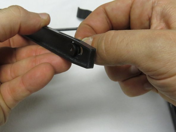 If the rubber grommets fall out, insert them as shown.