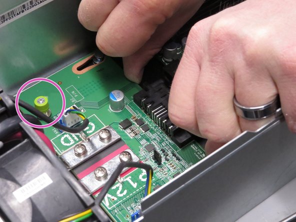 Screw in the thumbscrew.