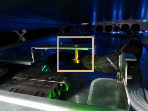 Route the Powerblade cable behind the tray cable guide, as annotated.
