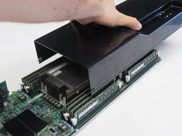 Push the lid towards the rear of the server.