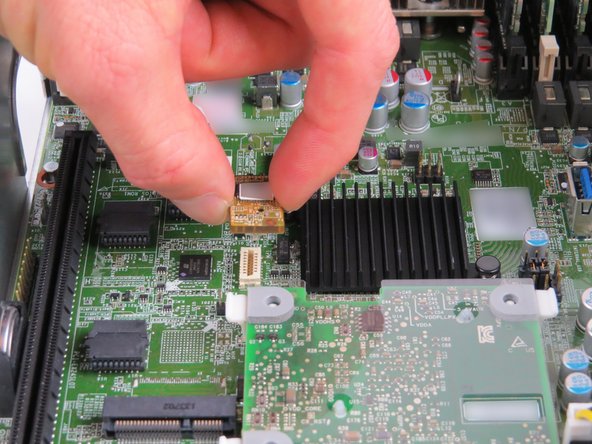 To remove, grip the module on each side, then pull upwards as shown.