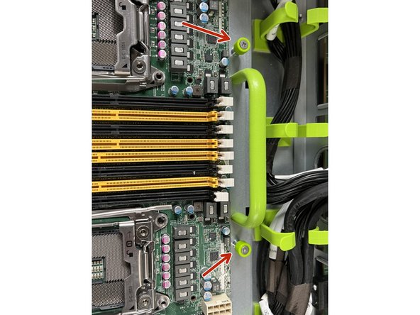 Loosen the two anchor screws at the rear of the board.