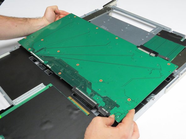 Place a new drive plane board into the storage chassis.