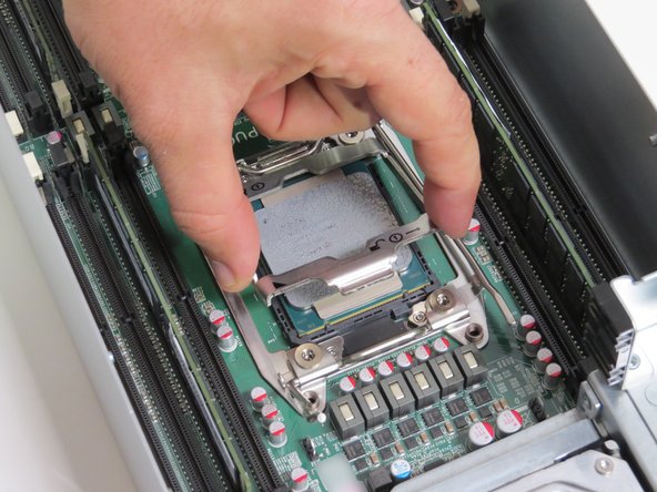 Lift the CPU retention bracket.