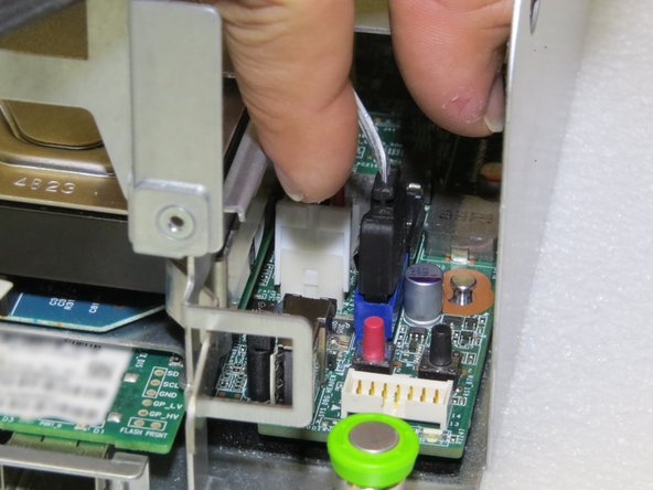 Pinch the SATA connector.
