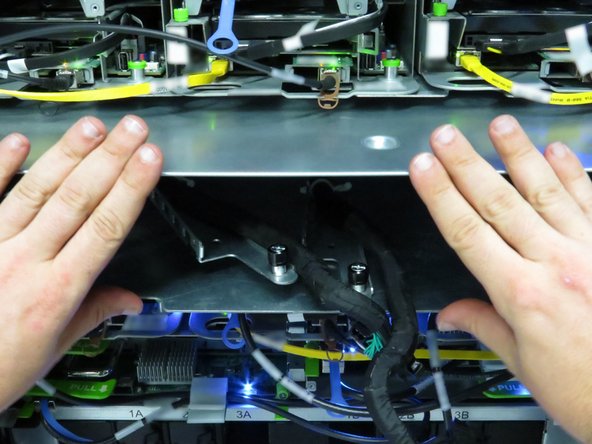 Slide the chassis into the Open Rack.