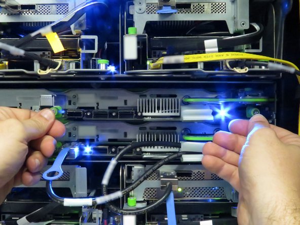 An audible 'click' will be heard when the tray has seated with its socket correctly.