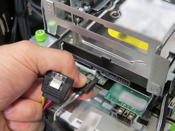 Disconnect the power and SATA connectors from the Hard Disk Drive (HDD).