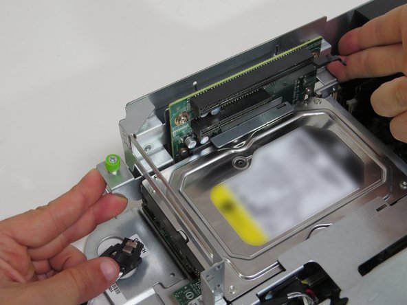 Push the riser card assembly upwards, until a 'click' is felt.