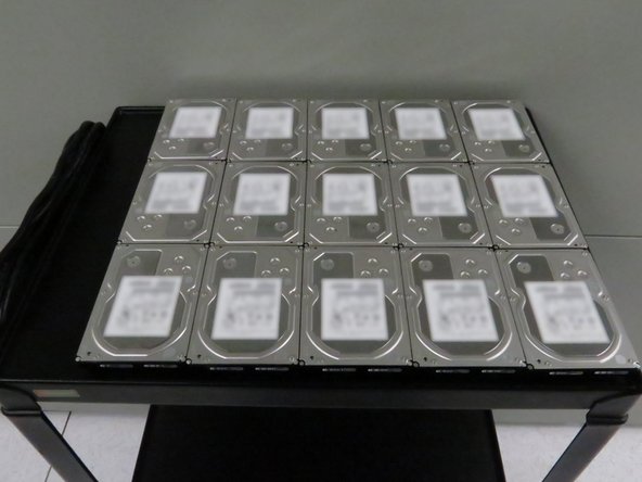 Place the hard disk drives on a work bench or cart.