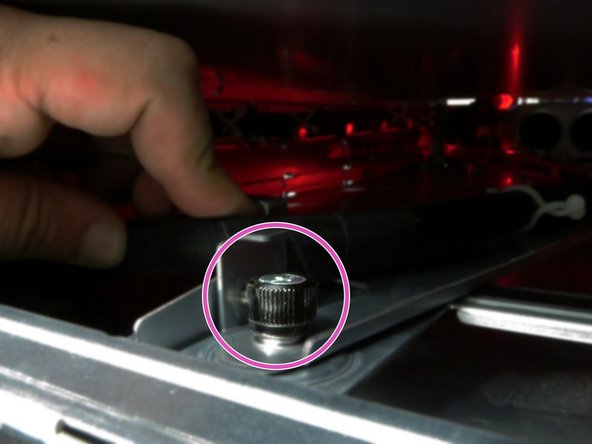 Tighten the storage tray thumbscrew.