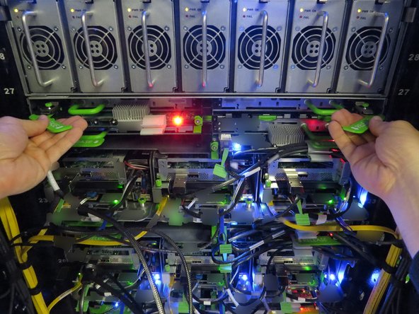 Engage the pull handles as shown.