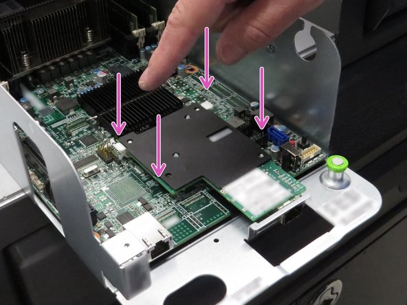 Press down on the four nylon retention tabs / standoffs securing the network interface controller