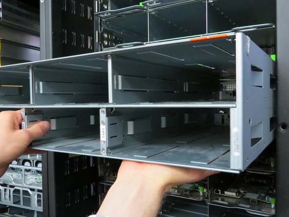 Place your hand under the power shelf to counterbalance the weight.