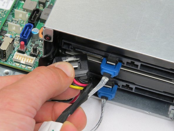 Disconnect the power and SATA connectors from the HDD.