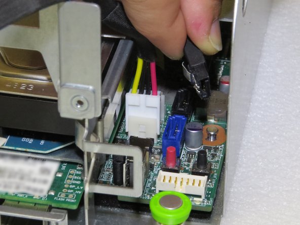 Pull connector upwards.