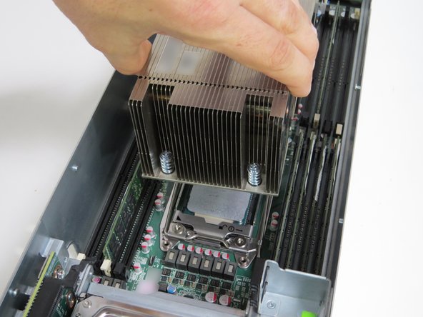 Place the heatsink to the side of the server chassis, near its respective CPU socket.