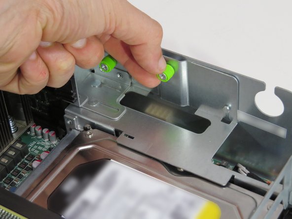 Loosen the thumbscrew near the Facebook part number, as shown.